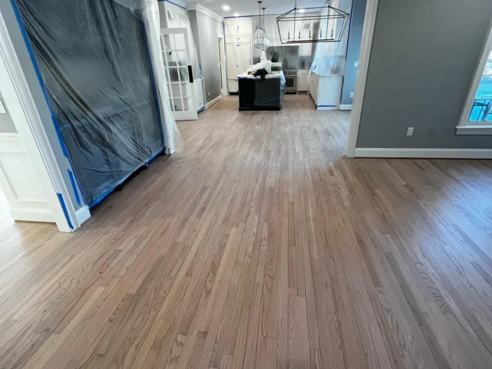 Refinished hardwood floor showing smooth surface and natural wood tones.