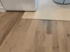 vinyl floor installation in a living area with smooth surface transition