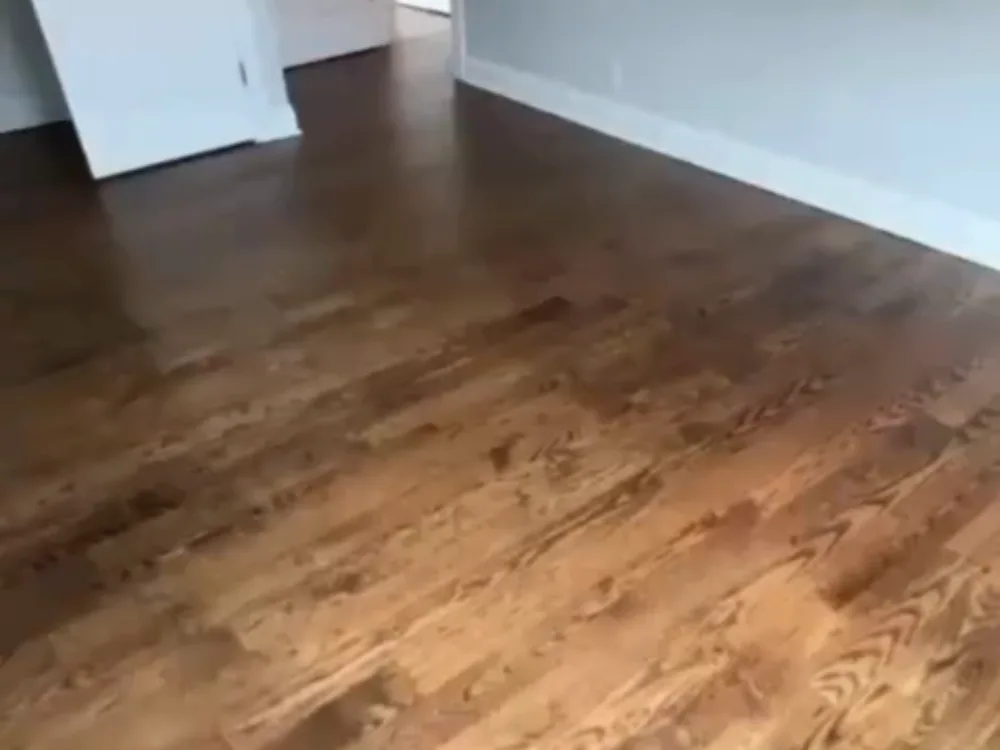Hardwood floor refinishing with provincial stain and smooth protective finish