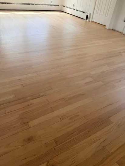 Seamless hardwood floor application across the room, finished with Nordic Seal Bona Mega.