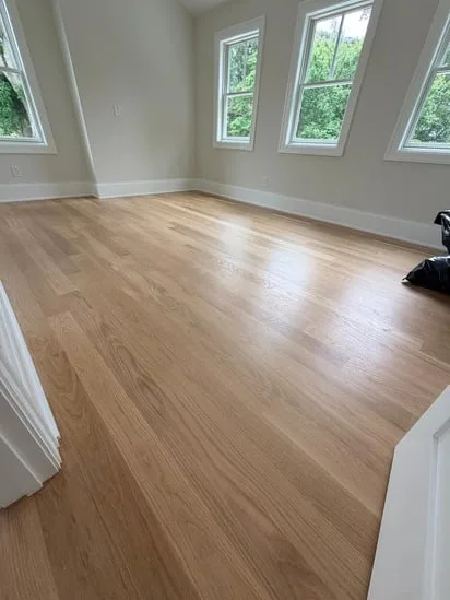 Wide view of an empty living space highlighting the durability of the Bona Traffic floor finish.